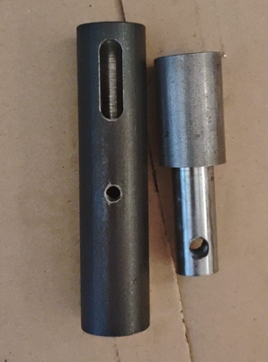 Embrague de roscado desmontado con cuerpo exterior y eje interior